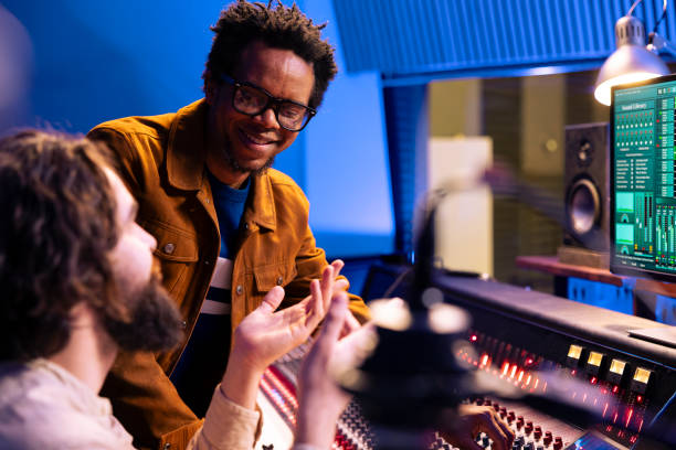 istock African american composer works with engineer in recording studio 2135080029