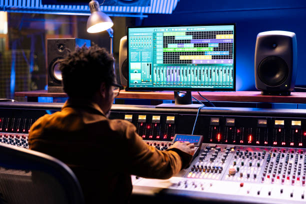 istock African american audio expert operates editing software to adjust sound settings 2135081119