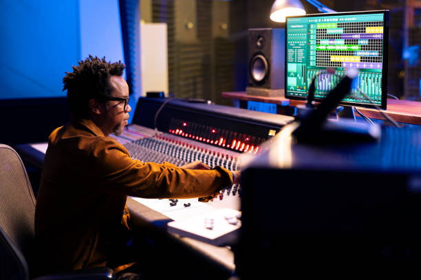 istock African american record producer composing tunes in control room 2135081633