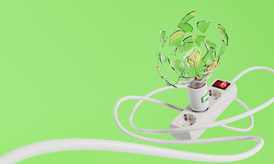 exploding light bulb connected to a power strip with tangled cord on a green background with copy space. Concept of energy, light and ecology. 3d rendering