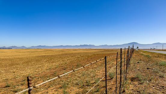 Farmers wire fence in the Namaqualand region of South Africa