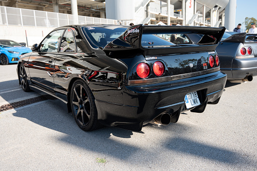 Montmelo, Spain – October 20, 2023: Rear view of a black ninth-generation Nissan Skyline GT R33 GTS25t at a Japanese sports car meet.