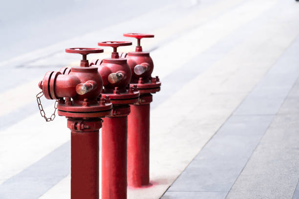istock red fire hydrant On the background of a concrete road 2135125696