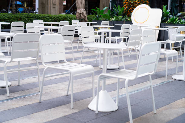 istock White dining table with chairs in a minimalist style shop. outdoor dining concept 2135125705