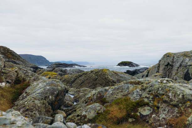Dramatic view of stone beach and the stormy sea on remote island of Western Norway, Scandinavia