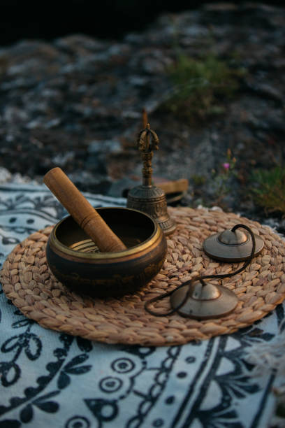 istock Singing bowl, Tingsha and Gantha Buddhist bell, sunset meditation. 2135159437