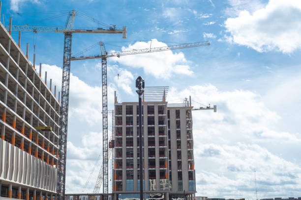 istock Double cranes working concrete building construction site, high-rise hotels, office building, skyscraper structure with precast concrete wall in downtown Irving, Texas, commercial real estate 2135160207