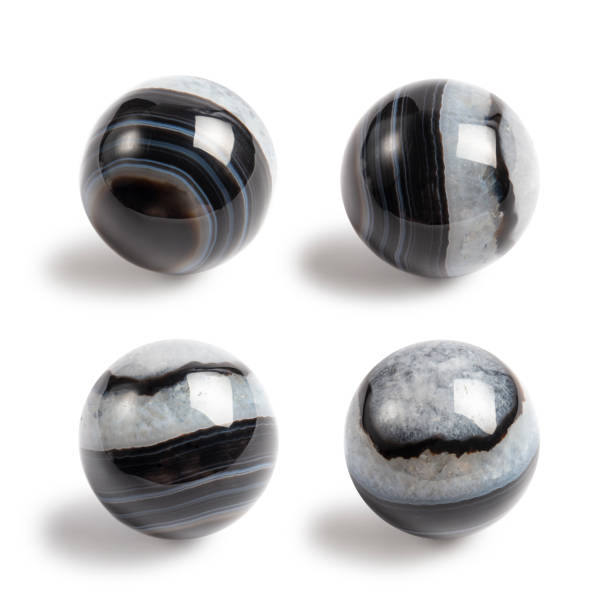 istock Black Agate sphere with quartz inclusions. Healing metaphysical crystal photo. Isolated background, four angles. Collecting and magic concept. Handmade photo, not AI. 2135165234