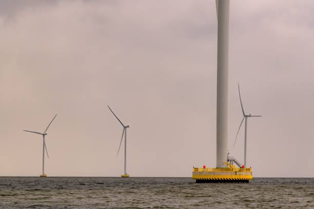 istock Wind turbines in an offshore wind park producing electricity 2135183567