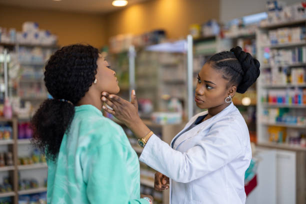 istock Woman with sore throat in a pharmacy 2135194090