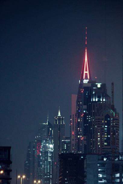 istock Illuminated Towers in the Glowing Cityscape 2135211130
