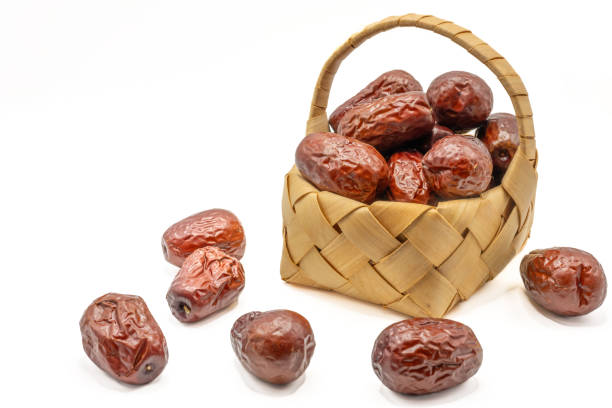 Dates in a basket on a white background. Isolated.