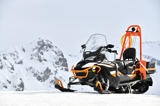 Snowmobile by winter in front of Mont Blanc