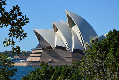 Sydney, Australia - July 31, 2014: Sydney Opera House under a blue sky, New South Wales, Australia.