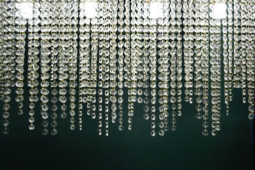 Chrystal chandelier close-up on a dark background
