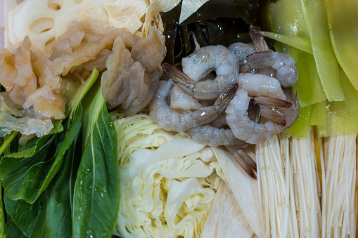 Fresh peeled shrimp, cabbage and many vegetable. Famous set of sukiyaki ingredients in restaurant