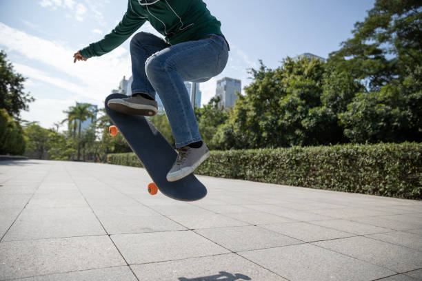 istock Skateboarder skateboarding in modern city 2135324592