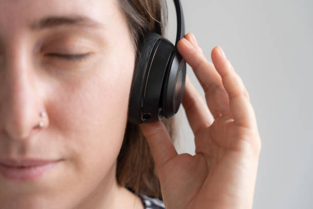 istock Young woman enjoying music 2135344340