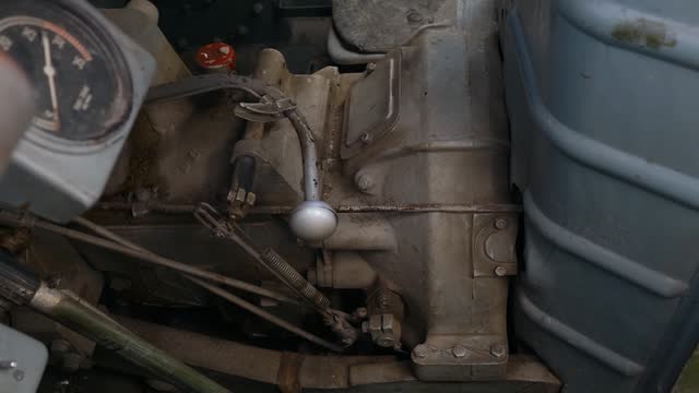 Interior and engine of mid-20th century tractor