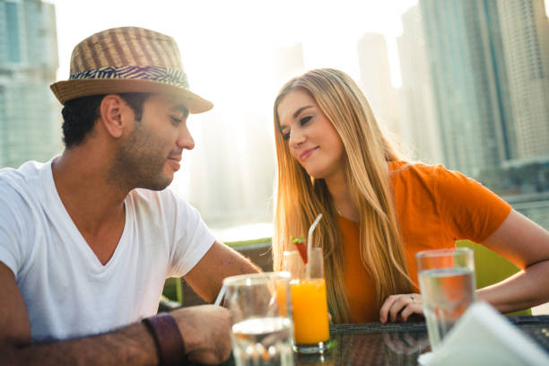 istock couple take a drink in Dubai Marina 2135364234