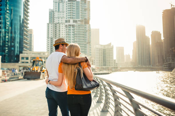 istock Couple in Dubai Marina walking togethers 2135367447