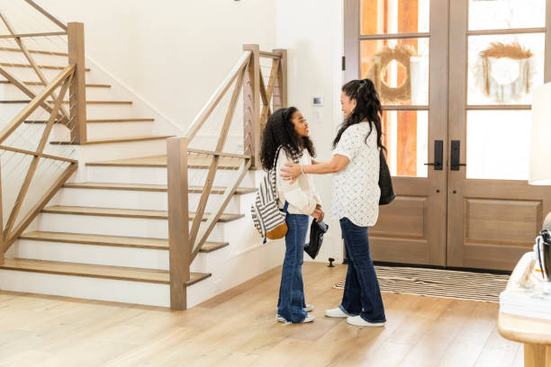 istock Before leaving for school, mom encourages elementary age daughter 2135381072
