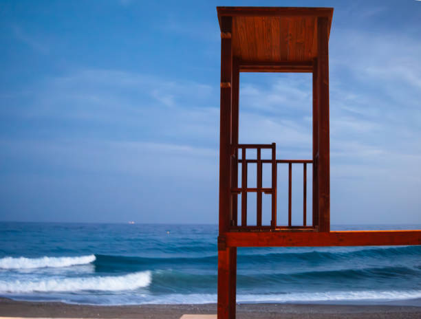 Wooden Lifeguard tower on beach in Spain at dusk