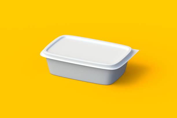 istock Plastic food container on orange background. Lunch box. Butter, cheese or ice cream package. Utensils for picnic. Disposable pack with lid for products. Fast food accessories. 3d render 2135403561