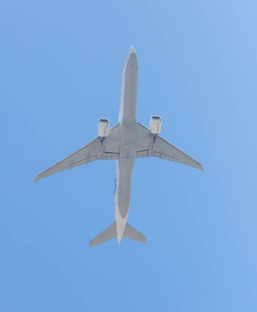 istock Airplane in flight against a blue sky 2135407425