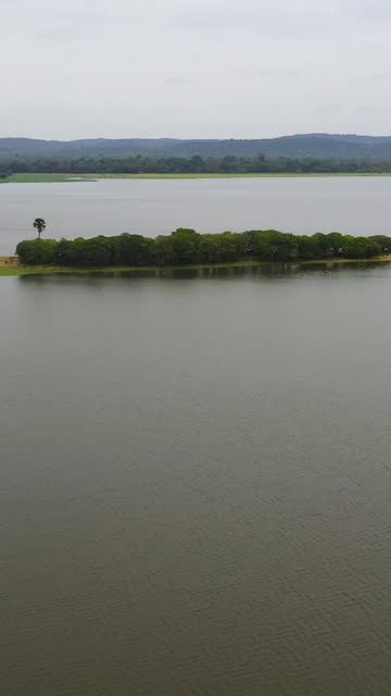 Tropical landscape in Sri Lanka: lake and mountains.