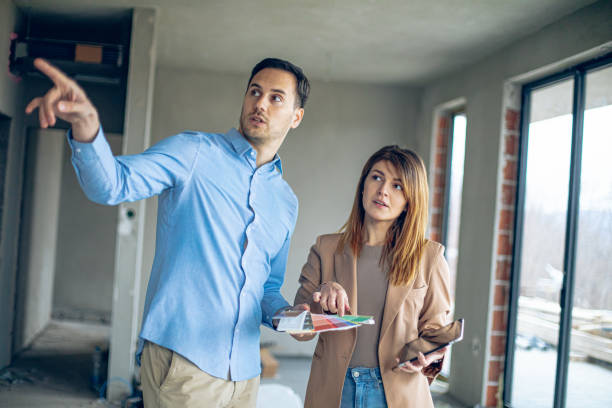 istock Interior designer consulting a client looking at a color swatch 2135495050
