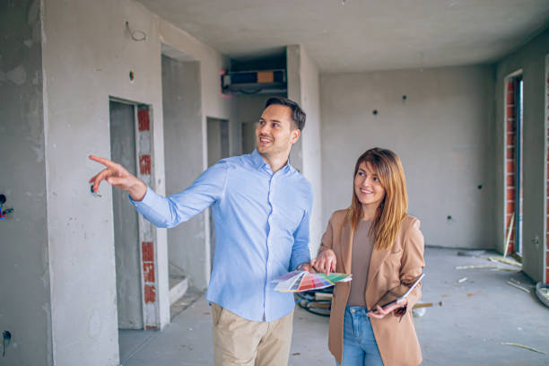 istock Interior designer consulting a client looking at a color swatch 2135507117