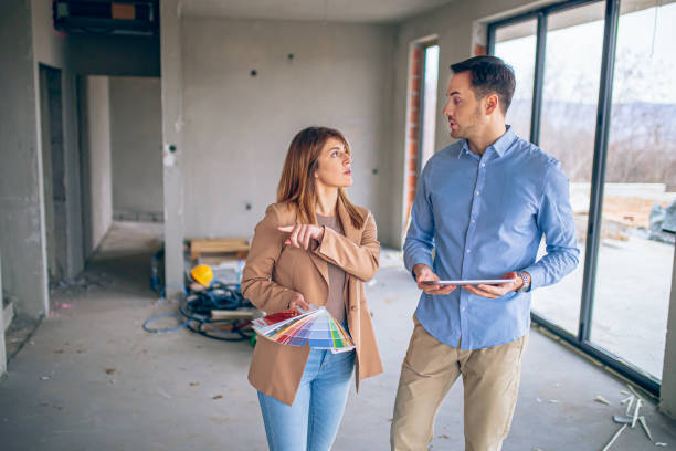 istock Interior designer consulting a client looking at a color swatch 2135508731