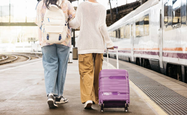istock Two woman walking on a train station. 2135525777
