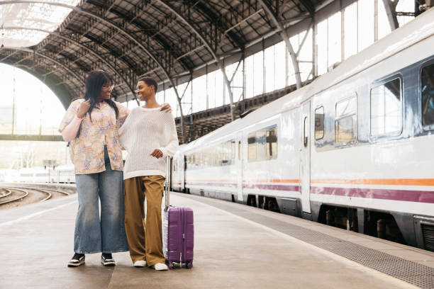 istock Two woman on a train station. 2135525786