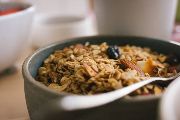 Bowl of fresh granola on table