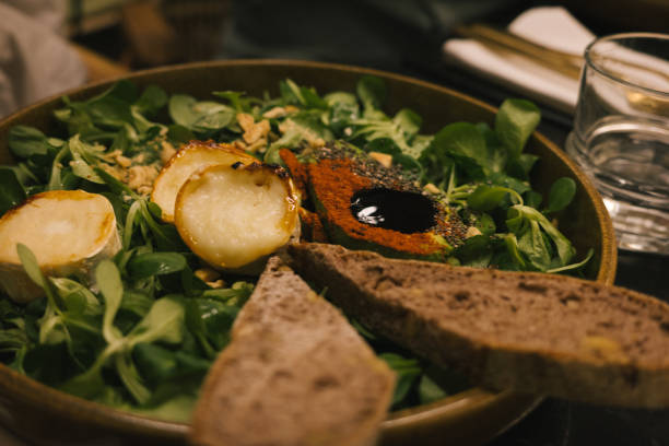 Fresh salad with grilled cheese and bread