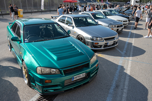 Montmelo, Spain – October 20, 2023: Nissan Skyline GT R34 tenth generation green in a Japanese car meet