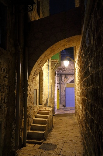 Jerusalem Old City - narrow alleys of Christian Quarter at night. Jerusalem, Israel.