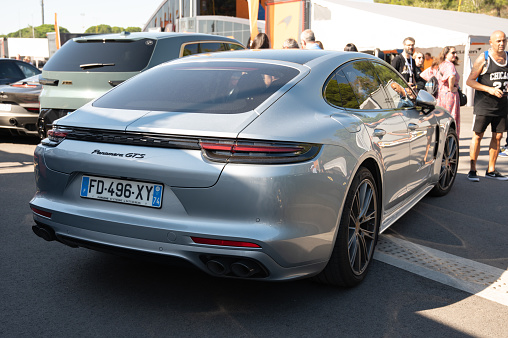 Montmelo, Spain – October 20, 2023: Rear view of a German luxury sports sedan, the silver Porsche Panamera GTS