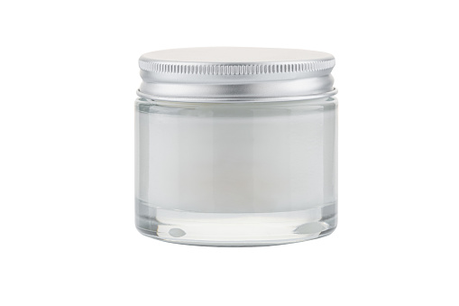 Glass jar of face cream scrub