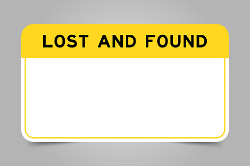 Label banner that have yellow headline with word lost and found and white copy space, on gray background