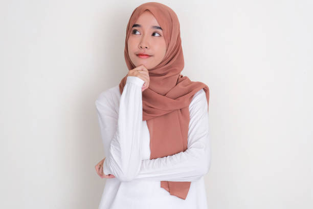 istock Moslem Asian woman looking beside thinking about something 2135622017