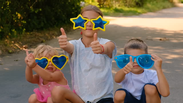 children in funny sunglasses. selective focus. kid.