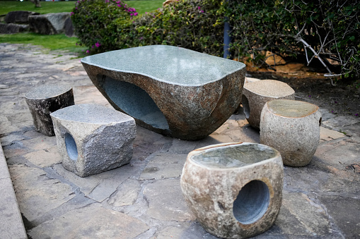 Stone tables and benches in the park