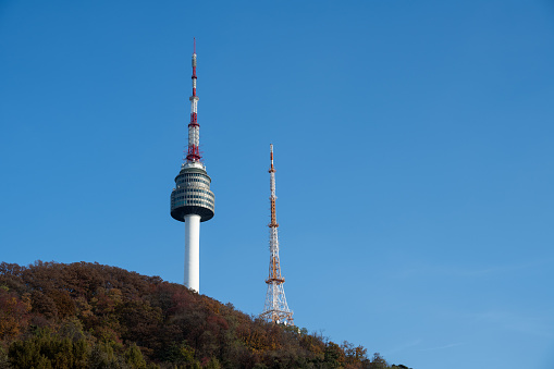 Telecommunication tower with clear blue sky background. Antenna on blue sky background. Radio and satellite pole. Communication technology.