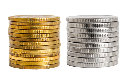 Set.Coins in a stack of gold and silver color. On a blank background.