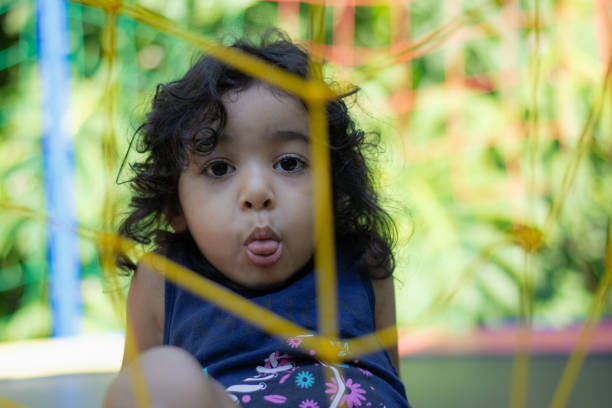 istock Girl playing on trampoline 2135684171