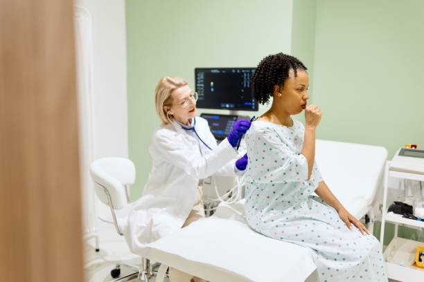 istock Doctor listening to patient’s back with a stethoscope 2135684214