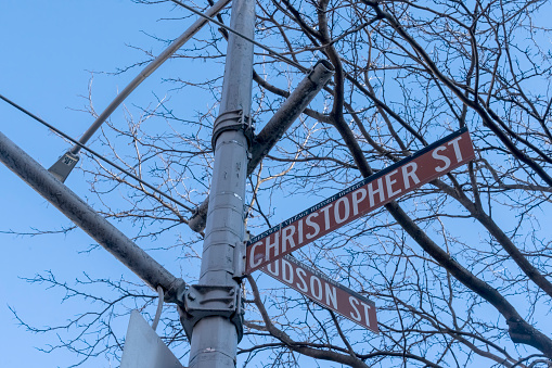 Christopher street, Greenwich Village, Manhattan, New York, USA - March, 2024. Christopher Street and Hudson Street crossroads.